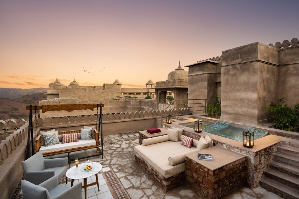 Luxury rooftop terrace with plunge pool at sunset