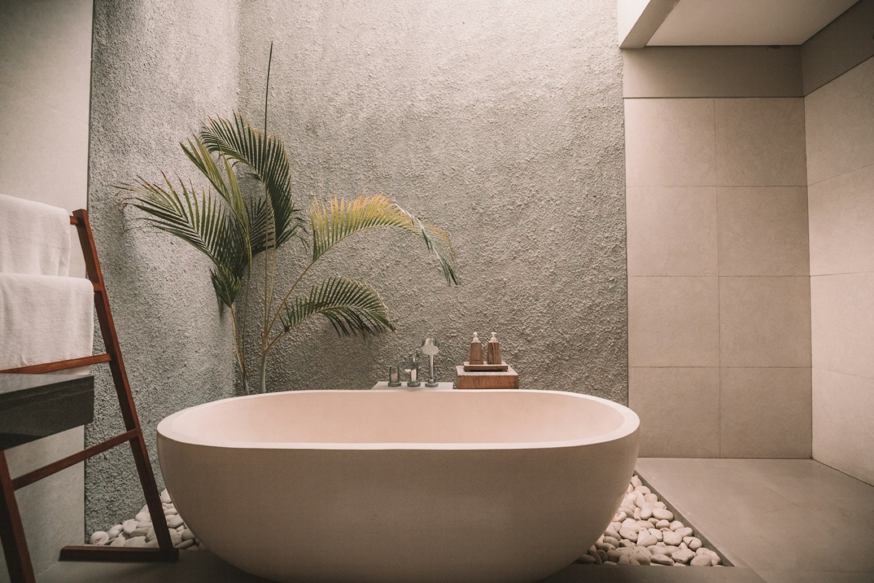 A stone soaking tub in a quiet spa room
